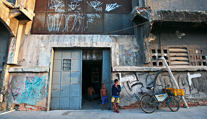 Children in front of a building which houses 82 families in the port district of Rio. Residents will be relocated to new housing ahead of the 2014 World Cup