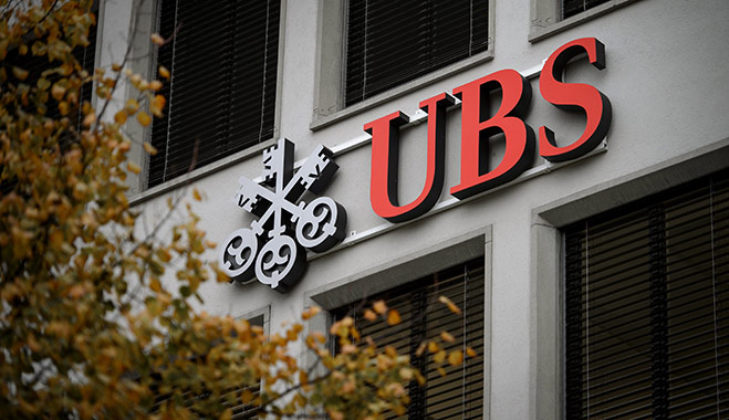 A logo of Swiss banking giant UBS is seen on a building in Zurich