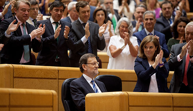 Spanish Prime Minister Mariano Rajoy is applauded in a parliament session. He has supported Princess Cristina’s right to remain innocent until proven guilty