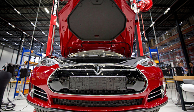 A fully-electric Tesla car on an assembly line at a Tesla Motors factory in Tilburg, Netherlands
