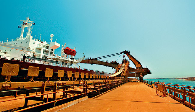 The worlds largest iron ore carrier, the Berge Stahl, is docked at the Rio Tinto port of Dampier, Western Australia