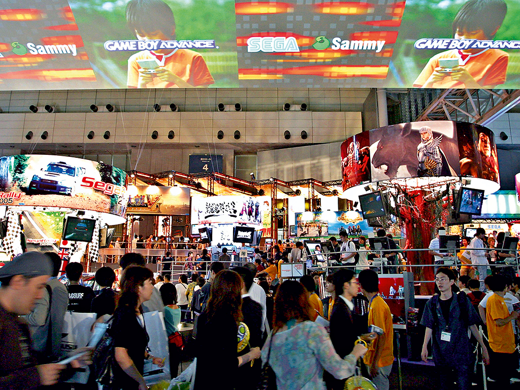 Crowds gather at the Sega and Sammy booth during the Tokyo Game Show in Makuhari, Chiba Prefecture, Japan