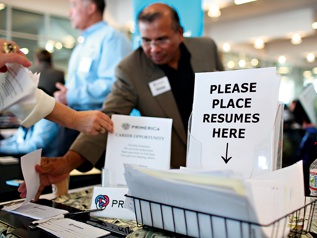 Resumes placed in a basket at a ‘Job Hunter’s Boot Camp’ in California