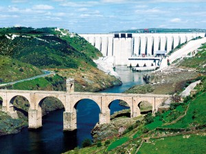 Alcántara hydro power scheme on the Tagus river, Spain, with downstream Roman bridge to the fore