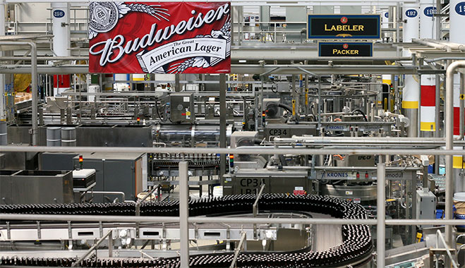 Bottles of Anheuser-Busch's staple beer Budweiser are packed in Missouri, USA. The company's decision to pay $5.8bn to buy back Oriental Brewery will see them regain a foothold in the fast-growing Korean beer market
