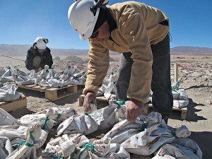 Lithium workers bag and tag brine extracted from an exploratory well in Salinas Grandes, Argentina. Abundant reserves of the mineral have supported the region's economic growth, but its regressive tax system is stifling competitiveness