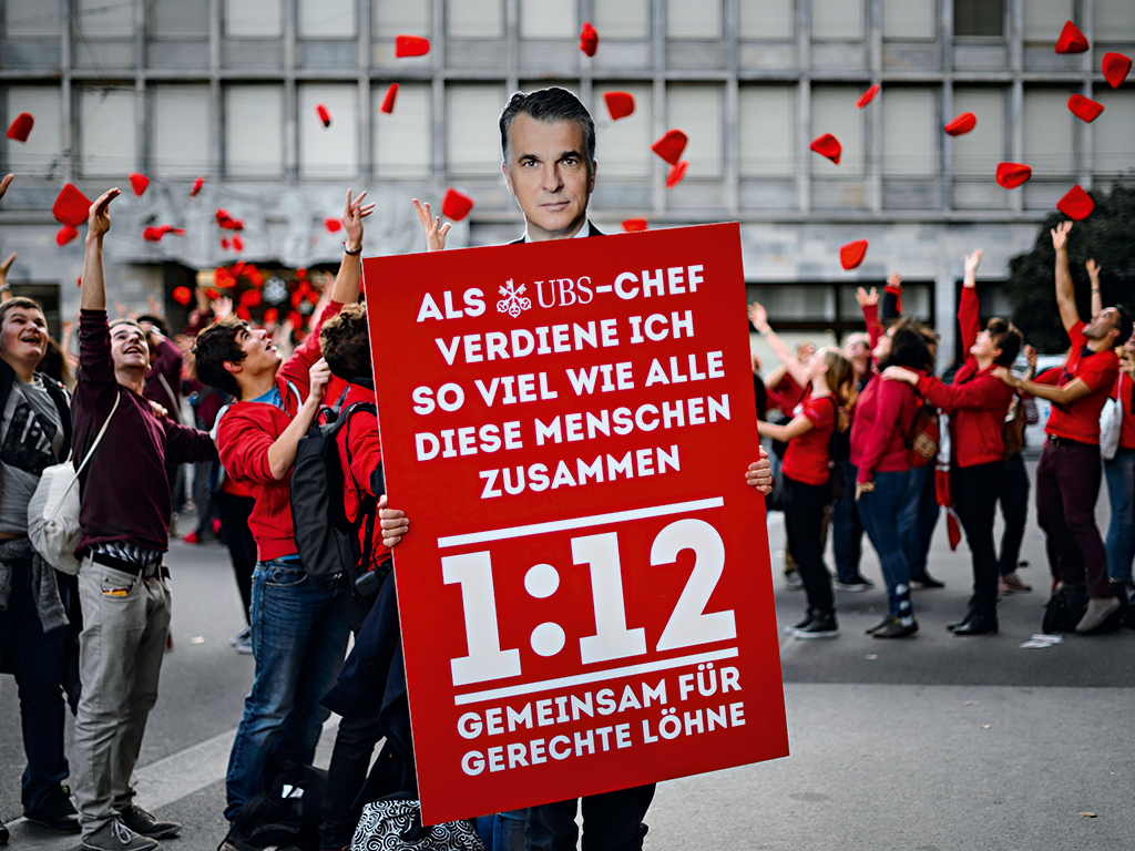 Swiss demonstrators advocating the proposed ‘1:12’ initiative that would have limited executive pay, before it was later defeated in a referendum. Since then, the Swiss have changed tack, channelling their efforts into fighting for unconditional basic income