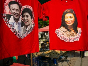 The smiles before the storm: t-shirts of Thailand's current and former prime ministers, Yingluck Shinawatra and Thaksin Shinawatra, respectively. Thailand's political conflicts have greatly damaged foreign investment in the country, leaving many concerned for the future ahead