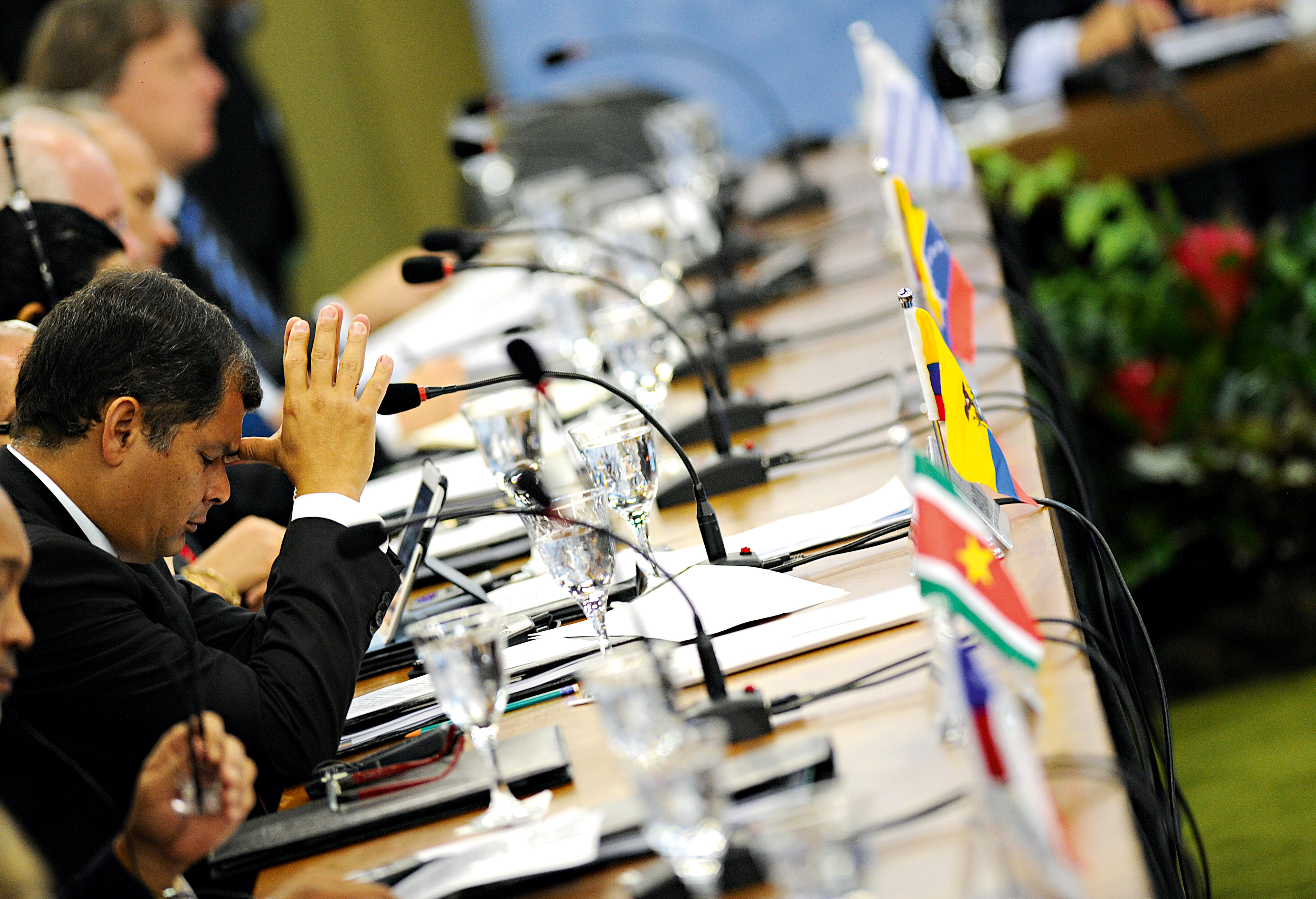 Ecuadorian President Rafael Correa reacts during a summit meeting of the Mercosur trade bloc