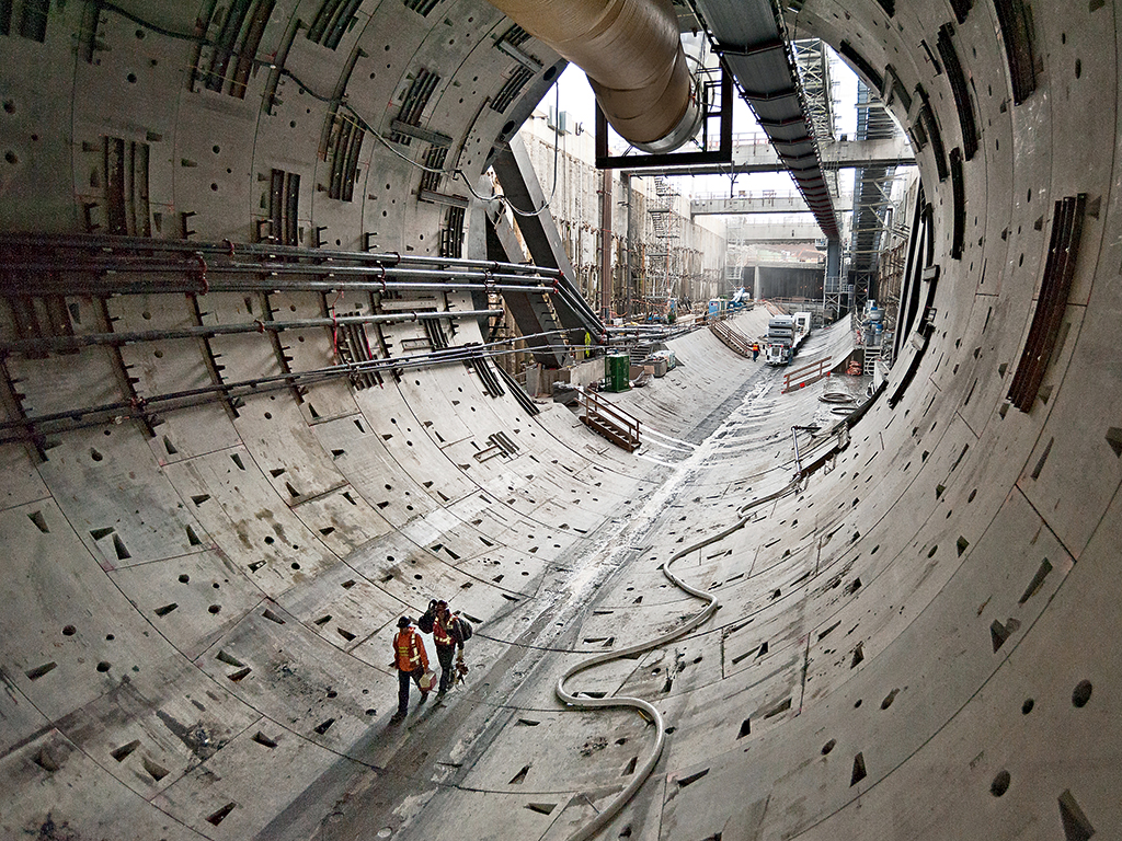 Two workers walk through the first rings of the SR 99 tunnel in October 2013. Image courtesy of Washington State Department of Transportation