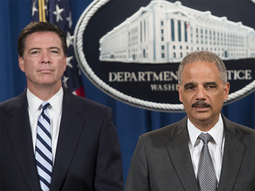 FBI Director James Comey and US Attorney General Eric Holder announced record charges of $8.9bn against BNP Paribas after it was found the bank had breached sanctions against Sudan, Iran and Cuba