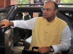Indian Finance Minister Arun Jaitley arrives at parliament to present the government's 2014 budget