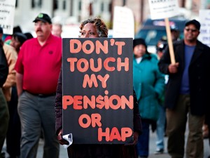 Many union and retired city workers protest in front of the US Courthouse where Detroit’s bankruptcy eligibility trial began