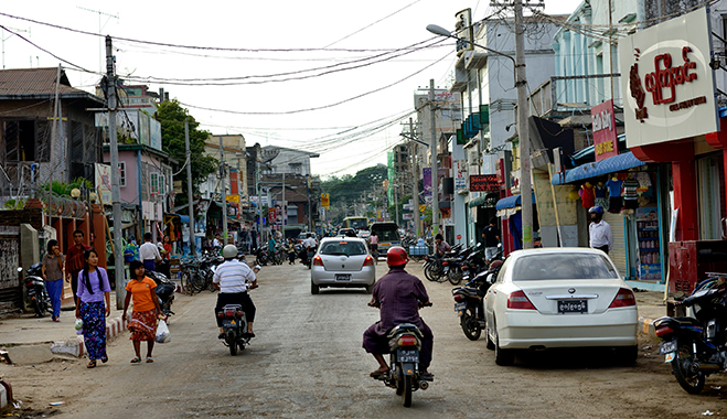 Daily life in Pyinmana, one of Myanmar's oldest cities. Political repression, global isolation and economic stagnation were once major problems for Myanmar, but essential reforms have accelerated growth in the country. Four-year-old Ayeyarwady Bank is helping to promote its banking sector, which has a vital role to play