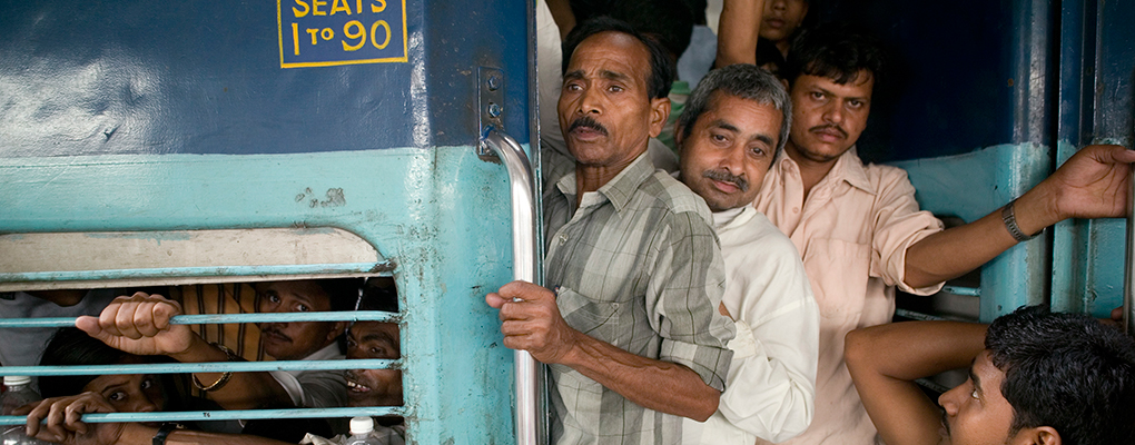 Passengers boarding a train Howrah station. Indian carriages are dangerously overcrowded