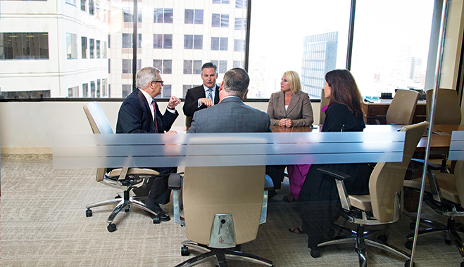 Chief Security Officer Joe Ford (far left) and Fraud Prevention Officer David Pollino (second left) speak with Head of Cash Management Dan Nagy (centre) and Cash Management International Sales Director Debbie Gersten (second from right) about ways to protect Bank of the West clients from heightened cybercrime risks