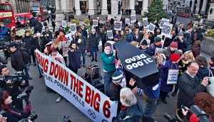 People gather to protest against the increase of energy bills outside the NPower headquarters