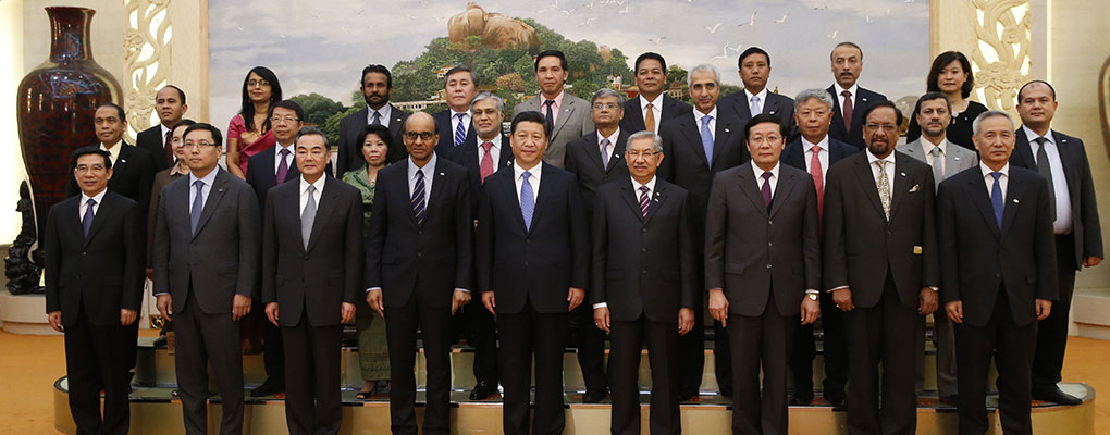 Chinese President Xi Jinping (C) poses at a meeting of reprentatives at the signing ceremony for the Asian Infrastructure Investment Bank at the Great Hall of the People on October 24, 2014 in Beijing, China