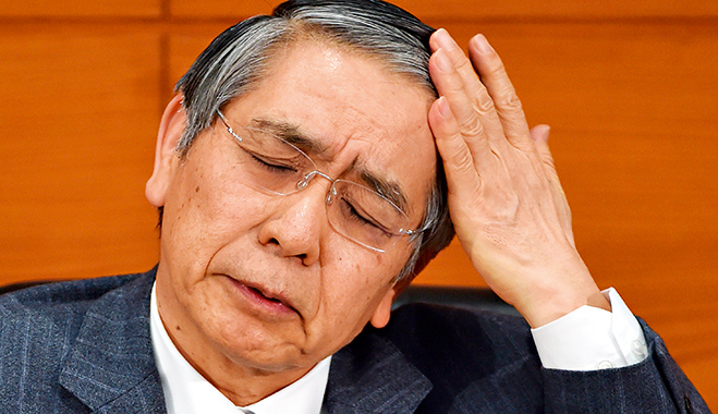 Bank of Japan Governor Haruhiko Kuroda gestures as he answers questions during a press conference at the Bank of Japan headquarters in Tokyo