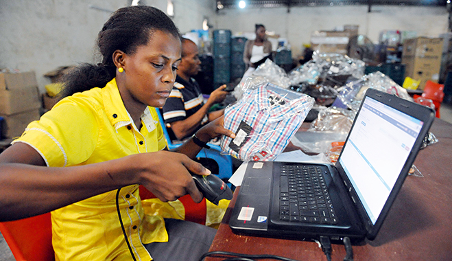 A worker scans a product at the Ikea warehouse in Lagos, Nigeria. Consumerism is increasing in Nigeria