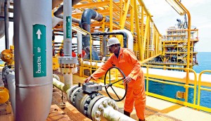 A worker inspecting facilities on an oil drilling platform in Nigeria. The oil and gas sector there has been the largest beneficiary of FDI