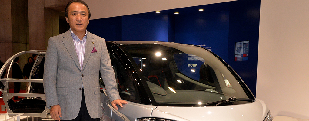 Hiroyuki Yanagi, Chief Executive of Yamaha, shows off the company's two-seater microcar, the Motiv. Yamaha plans to sell the vehicle in European cities, as well as Japan and other Asian countries