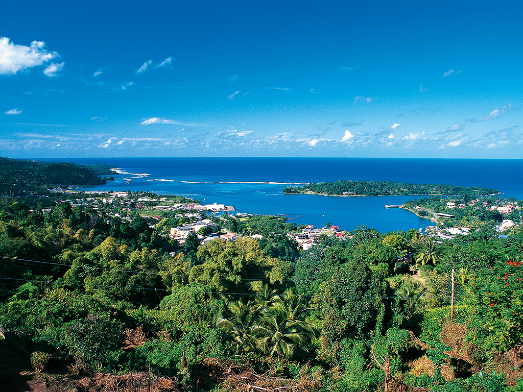 Port Antonio surrounded by tropical forest in Jamaica. The pension sector and infrastructure in the country are both showing signs of development