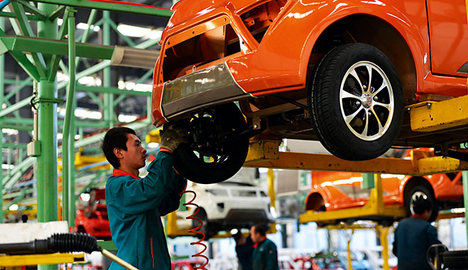 Workers assemble automobiles in a factory in China’s Shandong province. China’s manufacturing activity has worsened, signalling more weakness in the world’s second-largest economy