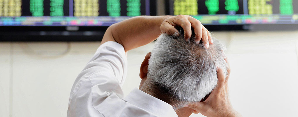 An investor monitors the stocks in China yesterday. The country has been in treacherous waters since its economy contracted