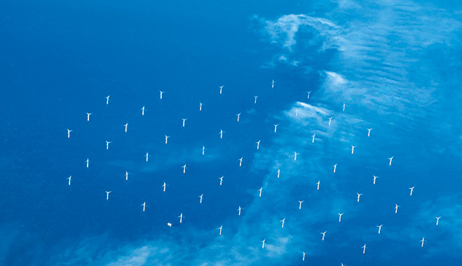 Offshore wind turbines near Barrow-in-Furness, UK. There has been an increase in renewable energy investment across the UK and Europe
