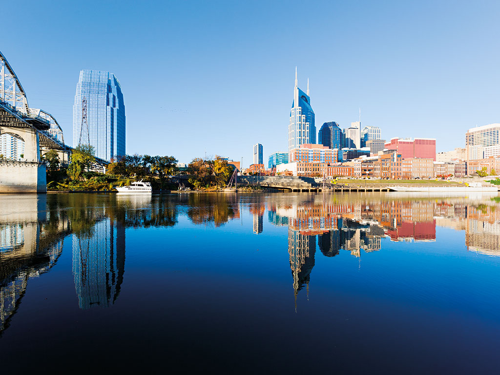 The city of Nashville reflected in the Cumberland river. Opportunities are opening up in southeastern US real estate