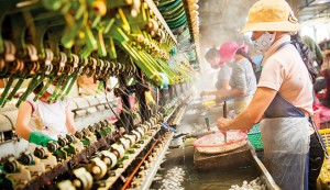 Women working in a factory in Ho Chi Minh City, Vietnam. Growth in the country has been strong, but other South-East Asian economies have held the region's collective growth back