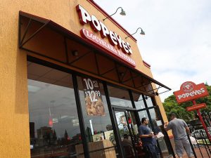 Restaurant Brands International, the owner of Burger King and Tim Hortons, will purchase multinational fried chicken chain Popeyes Louisiana Kitchen for $1.8bn