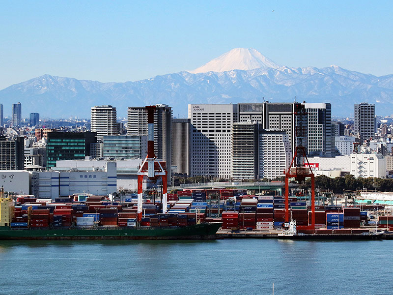 Mount Fuji is seen behind an international cargo terminal in Tokyo, Japan. Japanese exports saw a 14.9 percent annual increase in May