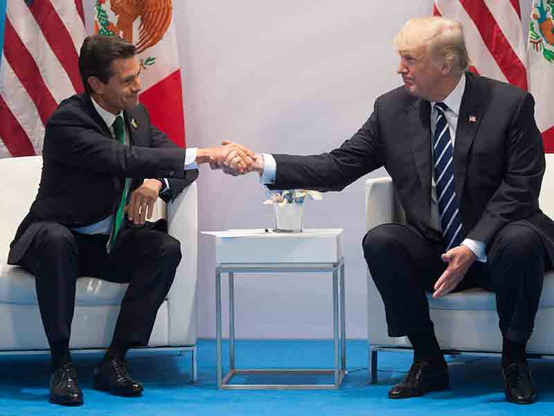 Mexican President Enrique Peña Nieto and US President Donald Trump shake hands at the G20 Summit in July 2017. Mexico appears to be examining possible revisions to NAFTA ahead of next month's talks