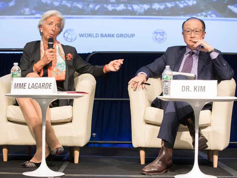 IMF Managing Director Christine Lagarde and World Bank President Jim Yong Kim at the IMF and World Bank semi-annual meeting. This October's meeting coincides with the OECD's optimistic projection for the world's economy