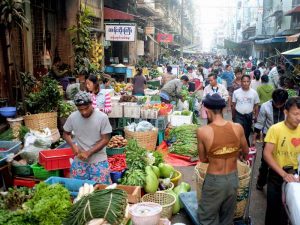 A market In Yangon, Myanmar. Myanmar is still a cash-based society. With the implementation of automatic cash services, CB Bank is hoping to update Myanmar's financial sector