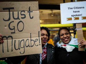 Protesters call for Robert Mugabe's resignation as prime minister of Zimbabwe in November 2017. Mugabe resigned from his position after 37 years in power