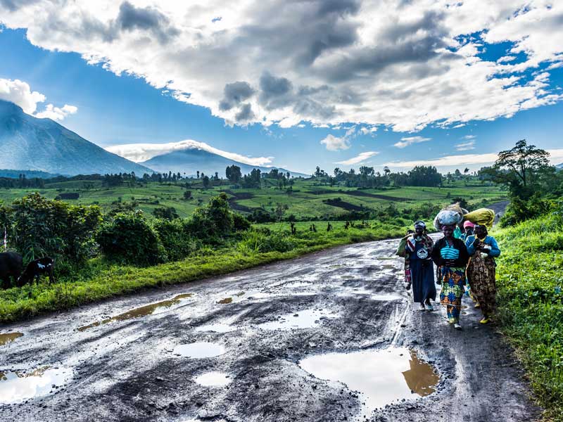 Local women carrying goods on poorly maintained roads, Democratic Republic of the Congo. The poor infrastructure across Africa has a negative impact on the continent's economic growth