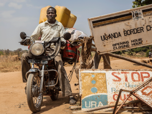 A man crosses the border in Moyo, Uganda. Sub-Saharan Africa stands out as the region that is in most need of the humanitarian aid that these innovative investment tools aim to deliver