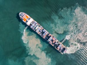 An aerial view of an unknown cargo ship off the coast of Guangdong, China. The two Chinese shipping firms have had their US assets' frozen, alongside other punitive measures